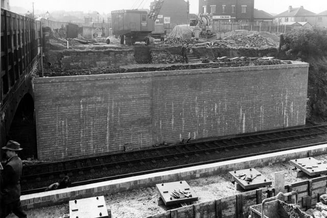 Construction of Cross Gates Bridge over Leeds-York railway. Crane supplied by M. Harrison and Co., Leeds, manufactured by Smiths of Rodley. Pictured in September 1954.