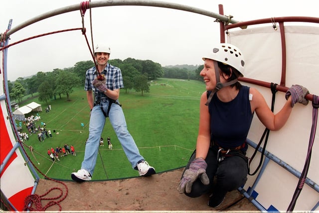 Actor Stephen McGann who played Sean Reynolds in Emmerdale starts his abseil at Roundhay Park in July 1999 watched by Alex Killeen of disability equality charity Sense.