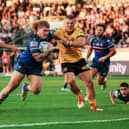 Wakefield Trinity's Caius Faatili goes over to score a try in the 52-14 win against Castleford Tigers. Picture by Alex Whitehead/SWpix.com.