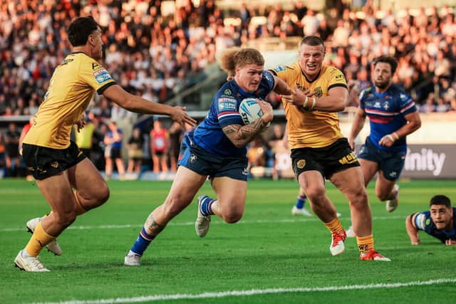 Wakefield Trinity's Caius Faatili goes over to score a try in the 52-14 win against Castleford Tigers. Picture by Alex Whitehead/SWpix.com.