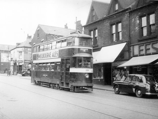 Tram No 559 travelling along Tong Road on route 18 to Cross Gates. Lees of Leeds shoe manufacturers can be seen on the right at 46a Tong Road. Pictured in September 1954.