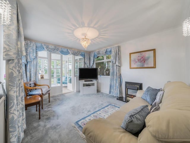 The sitting room is a versatile space, ideal for family gatherings and everyday living and is also located to the rear of the property.