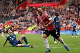 DAY TO FORGET: Glum Leeds United faces as a strike from Adam Armstrong, above, leads to Southampton's third goal at St Mary's. Photo by George Tewkesbury/PA Wire.