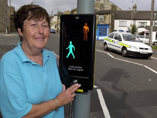Campaigner Jean Thompson celebrates after a new pedestrian crossing was installed on Lowtown, Pudsey, to benefit pupils at the nearby Pudsey Lowtown School, on September 3, 2001.