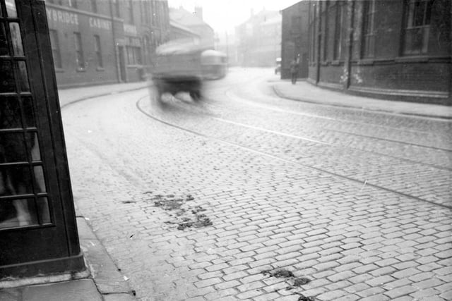 Hunslet Lane between Dawbridge Street and Pym Street in August 1938 showing the Lady Bridge Cabinet Works to the left. On the opposite side of the road the corner of Kitson and co. at the Airedale Foundry can be seen.
