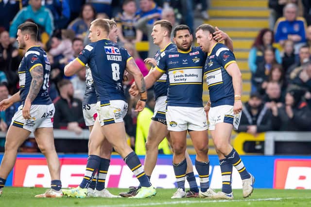 Picture by Allan McKenzie/SWpix.com - 09/04/2023 - Rugby League - Betfred Super League Round 8 - Leeds Rhinos v Huddersfield Giants - Headingley Stadium, Leeds, England - Leeds celebrate Cameron Smith's (r) try against Huddersfield.