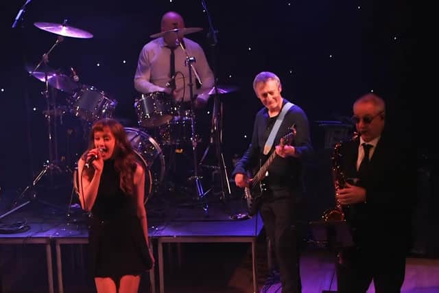 Robert Arkins (centre of photo) with The Commitments band.