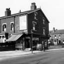 Harehills Lane in September 1949. In focus is 'H. Ingle, Fruit and Flowers', 358 is 'P. Littlehales Grocers'. Further down the road are Sutherland Terrace and Mount, and Compton Row and Crescent. An advertisement for 'Wisk Washing Products' can be seen. On the pavement a lamppost, pillar box and pedestrians are visible.