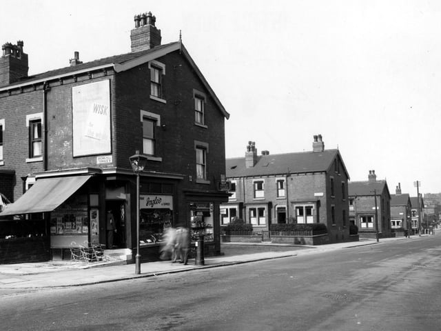 Harehills Lane in September 1949. In focus is 'H. Ingle, Fruit and Flowers', 358 is 'P. Littlehales Grocers'. Further down the road are Sutherland Terrace and Mount, and Compton Row and Crescent. An advertisement for 'Wisk Washing Products' can be seen. On the pavement a lamppost, pillar box and pedestrians are visible.