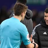 Leeds United's Spanish head coach Javi Gracia (R) shakes hands with the officials after the English Premier League football match between Leeds United and Southampton at Elland Road  (Photo by OLI SCARFF/AFP via Getty Images)