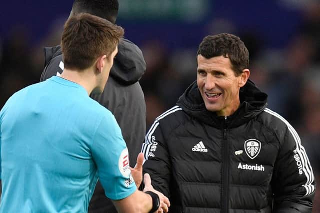 Leeds United's Spanish head coach Javi Gracia (R) shakes hands with the officials after the English Premier League football match between Leeds United and Southampton at Elland Road  (Photo by OLI SCARFF/AFP via Getty Images)