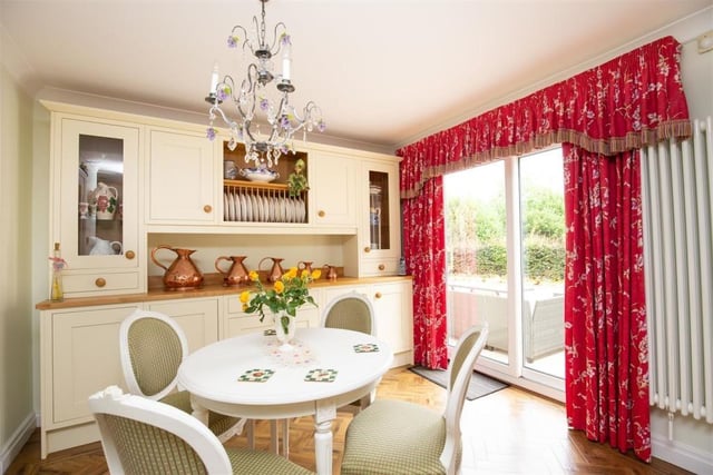 This cheerful breakfast room is open plan to the kitchen.
