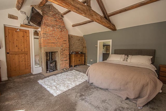 A real warmth to this spacious yet cosy beamed bedroom within the property.
