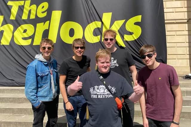 The Sherlocks meet fan Toby Sockett outside Sheffield City Hall