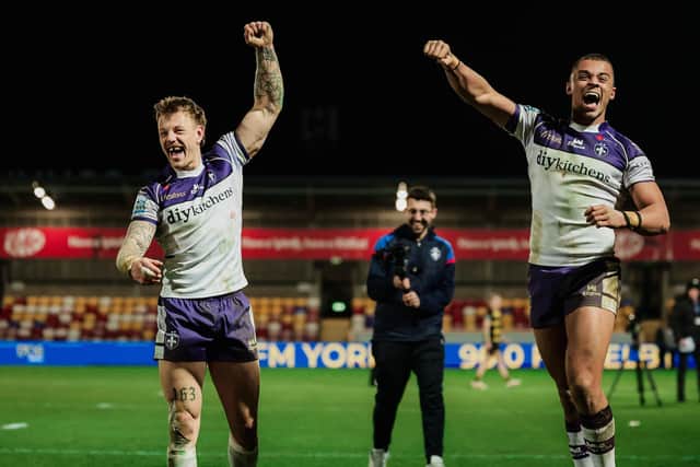Wakefield Trinity's Tom Johnstone, left and Corey Hall celebrate last week's tough win at York Knights. Picture by Alex Whitehead/SWpix.com.