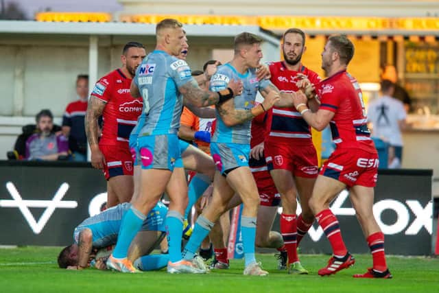 A disagreement between Liam Sutcliffe and his former Rhinos teammate Matt Parcell following Richie Myler's second try. Picture by Bruce Rollinson
