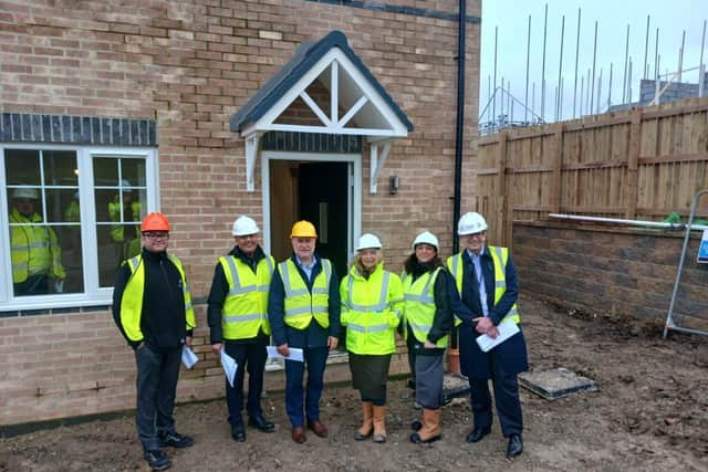MHA chief executive Lee Bloomfield (centre left) and regeneration manager Tracie Naylor (centre righ