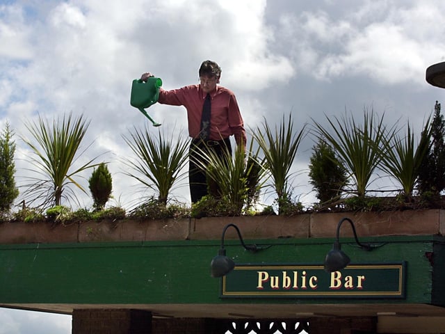 Manager Dave Sim attending to some of the plants at The Broadway pub on Dewsbury Road in May 2002.