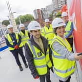 Alex Sobel MP and Cllr Helen Hayden sign concrete work during their tour of the Mabgate site.