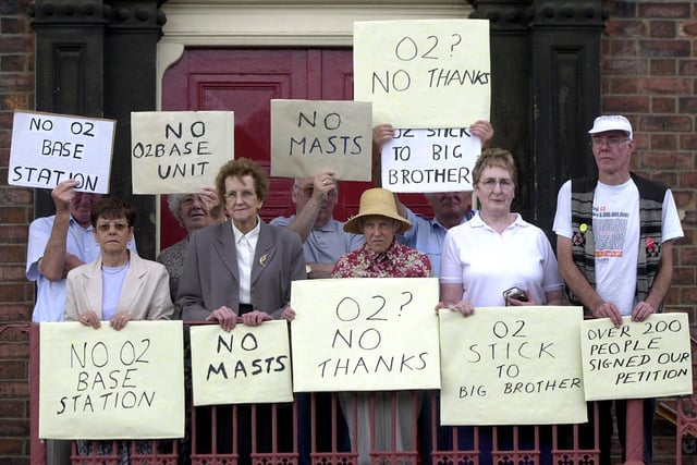 Residents protest against the installation of a communications mast on Beeston Methodist Church in July 2003.