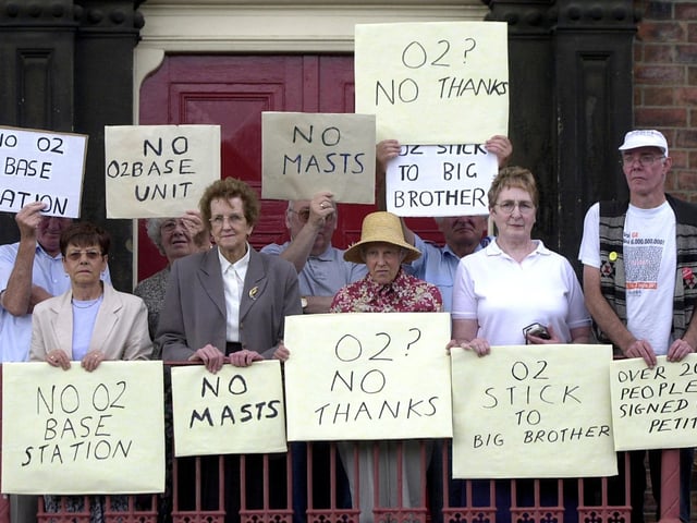 Residents protest against the installation of a communications mast on Beeston Methodist Church in July 2003.