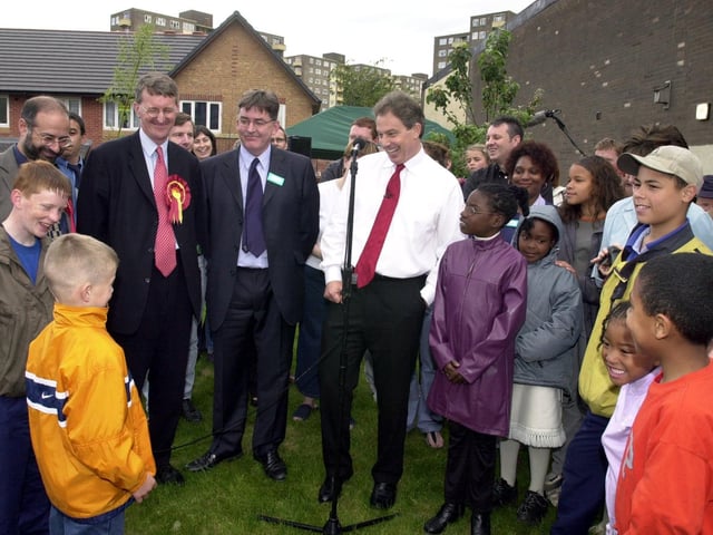 Prime Minister Tony Blair chats to youngsters before officially opening the Cromwell Mews development in June 2001.
