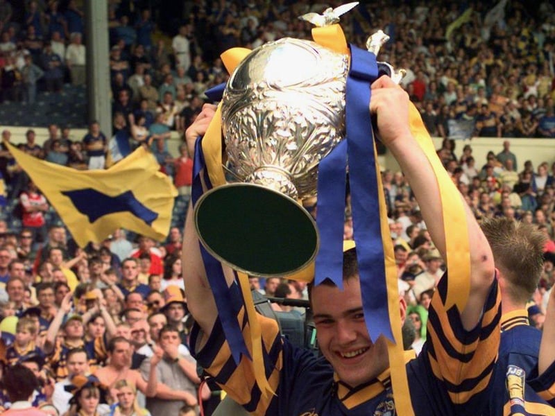Rhinos captain Iestyn Harris shows off the big prize.