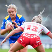 Leeds Rhinos' Grace Field is tackled by Jodie Cunningham of St Helens. Picture by Olly Hassell/SWpix.com.