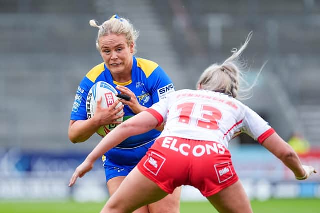 Leeds Rhinos' Grace Field is tackled by Jodie Cunningham of St Helens. Picture by Olly Hassell/SWpix.com.