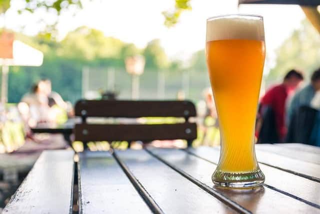 Sitting outside in the sun it is the perfect place to enjoy a cold beer with a friend.