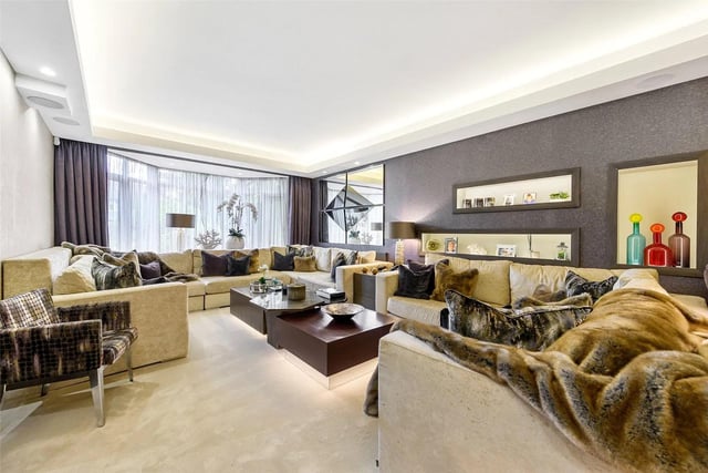 This stunning living room is one of seven reception rooms designed for entertaining guests.