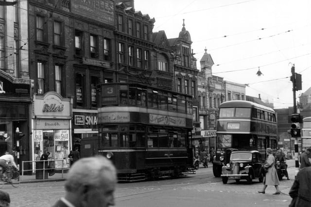 Tram on route 3 to Briggate number 10 bus to Wakefield and Kettlethorpe can also be seen. Businesses visible include Jacksons Stores Ltd at 160 Lower Briggate and Sillers Economic Ltd Household Drapers at 155.