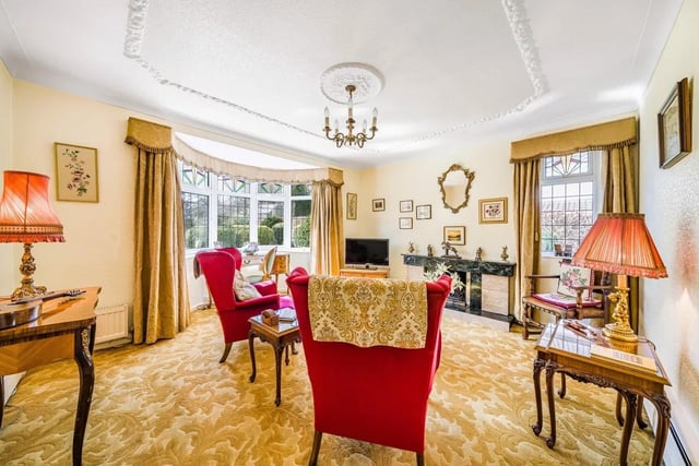 The living room features a vast bay window which looks out over the immaculate front garden which is a long and well established buffer from the road.