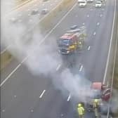 Firefighters at the scene of the car fire on the M1 motorway near Leeds and Wakefield (Photo by National Highways)