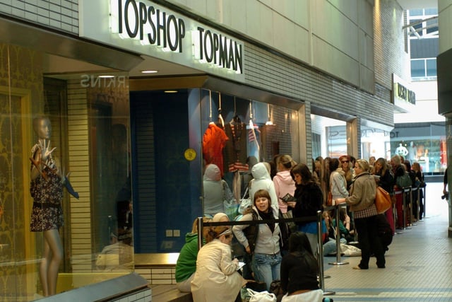 Early morning shoppers queue to be the first to get their hands on the new Kate Moss collection at Top Shop in 2007. The store closed in 2021.