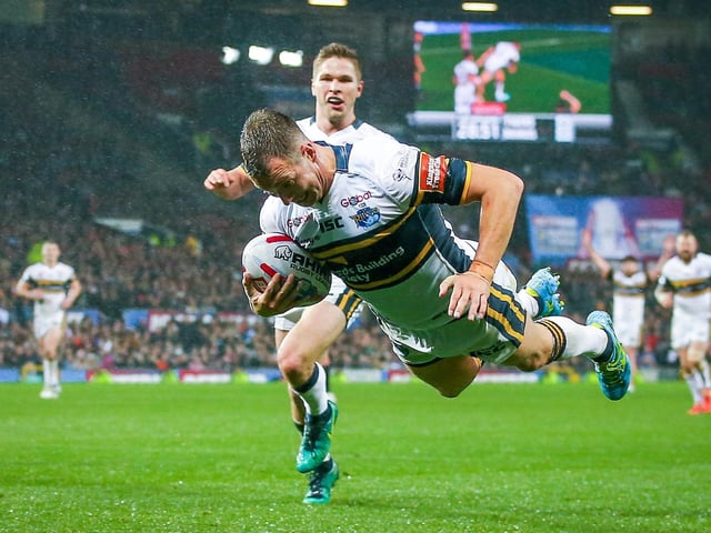 Man of the match Danny McGuire scores for Leeds Rhinos.
