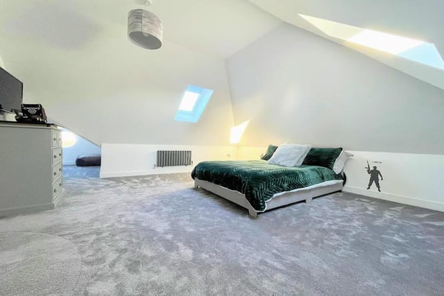 This spacious second floor bedroom has two elevated Velux windows which let in lots of light.