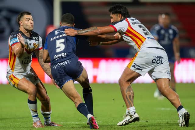 Leeds Rhinos signings Nick Cotric, left and Edenn Rogers-Smith tackle Benjamin Laguerre during Catalans Dragons win against Toulouse Olympique last month. Picture by Fabrice Rodriguez/SWpix.com.