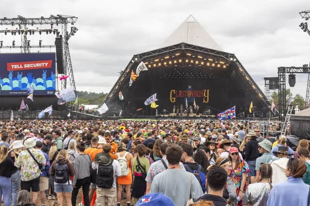 People enjoy the first proper day of Glastonbury Festival as the music gets underway.
