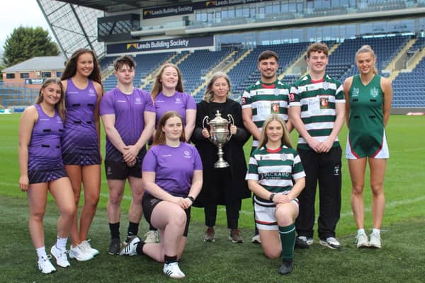 Denise McCardle, centre, with the Varsity trophy that will be fought over by Leeds Beckett Universit