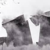 The 300ft cooling towers at Skelton Grange 'A' power station in Leeds,  each weighing 4,000 tonnes, are sent crashing down by a controlled explosion in November 1989