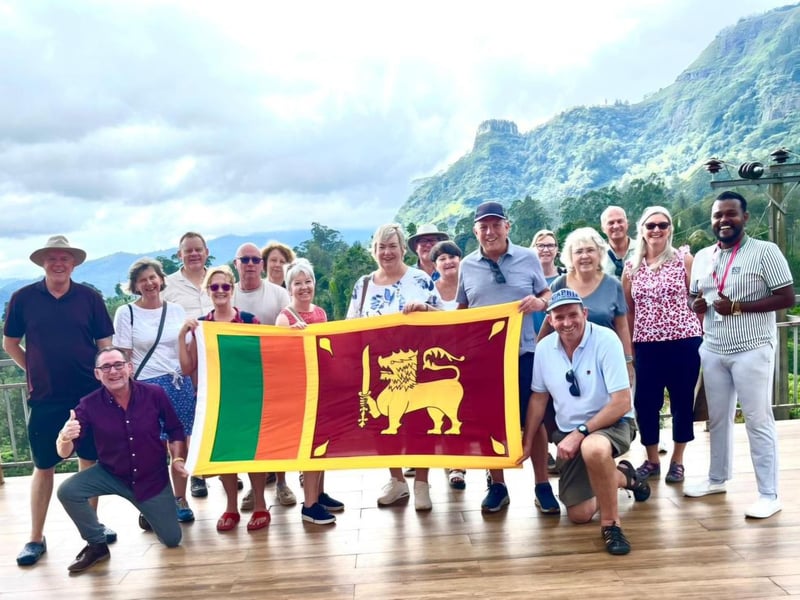Travelsphere Highlights of Sri Lanka tour party fly flag for accommodating nation