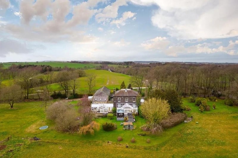 Sitting in approximately five acres, this estate hosts three dwellings.