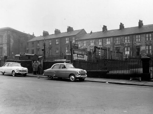 Hanover Place showing signs for Yorkshire Hut Co., Ltd. in the centre. To the left is the building which was originally Hanover Square Methodist Church, but was later used as a warehouse. The Sunday School building in Hanover Square was used both for services and Sunday School, and several midweek meetings were held there. In 1955 the congregation joined with Oxford Place Chapel. Park Lane Council School is off camera to the right. Pictured in January 1955.