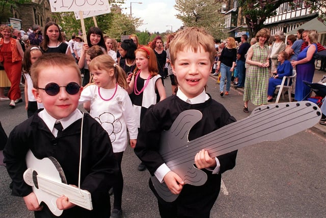 Ilkley Carnival in May 1999. Two young pop stars from the Sacred Heart Primary School  - Ben Below and Dale Sanderson - join in the town's carnival parade.