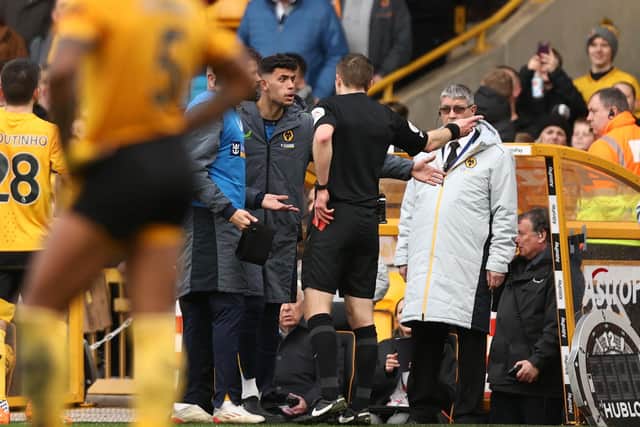 WOLVERHAMPTON, ENGLAND - MARCH 18: Matheus Nunes of Wolverhampton Wanderers receives a red card from Referee Michael Salisbury from the bench during the Premier League match between Wolverhampton Wanderers and Leeds United at Molineux on March 18, 2023 in Wolverhampton, England. (Photo by Naomi Baker/Getty Images)