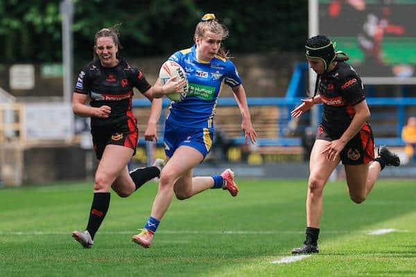 Evie Cousins makes a break for Leeds Rhinos in the Betfred Women's Super League clash with St Helens at AMT Headingley. Picture by Alex Whitehead/SWpix.com.