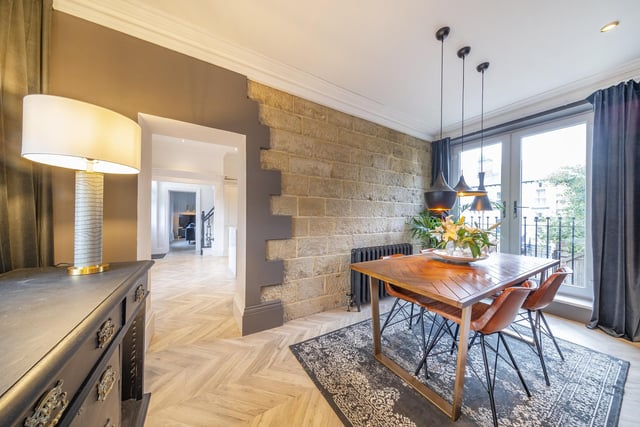 Sitting off the kitchen is a formal dining room which boasts original exposed stone feature wall an offers a fantastic space for entertaining with a Juliette balcony.