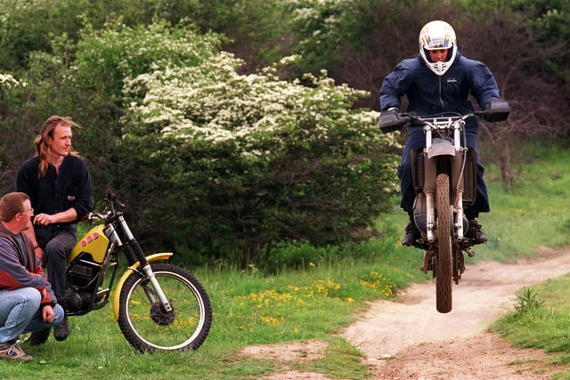 Plans were revealed for a off-road motorcycle track at Barnbow Common in June 1996. Pictured is chair of the off road biking campaign, Chris Nelson (far left) and Mick Richmond, project developer watch  a biker use the proposed track .
