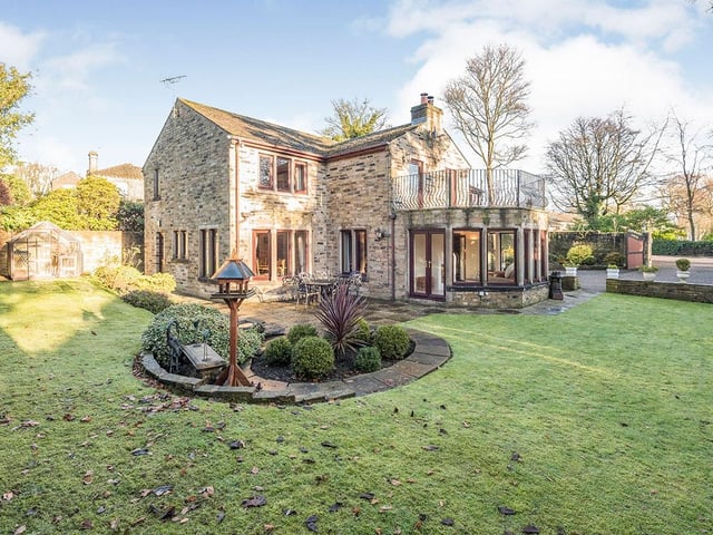 Attractive lawned and private grounds are to three sides of the house.
